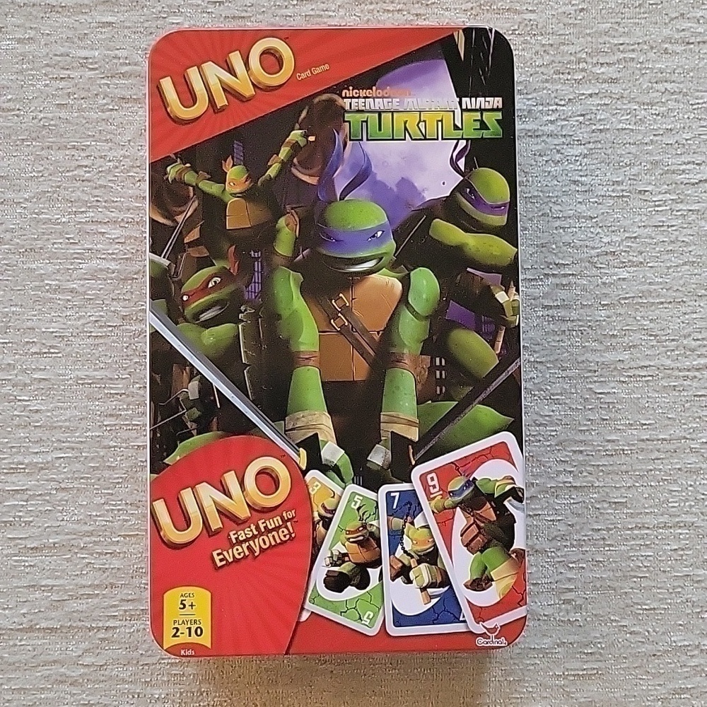 Uno Teenage Mutant Ninja Turles card game in storage tin. Great condition.